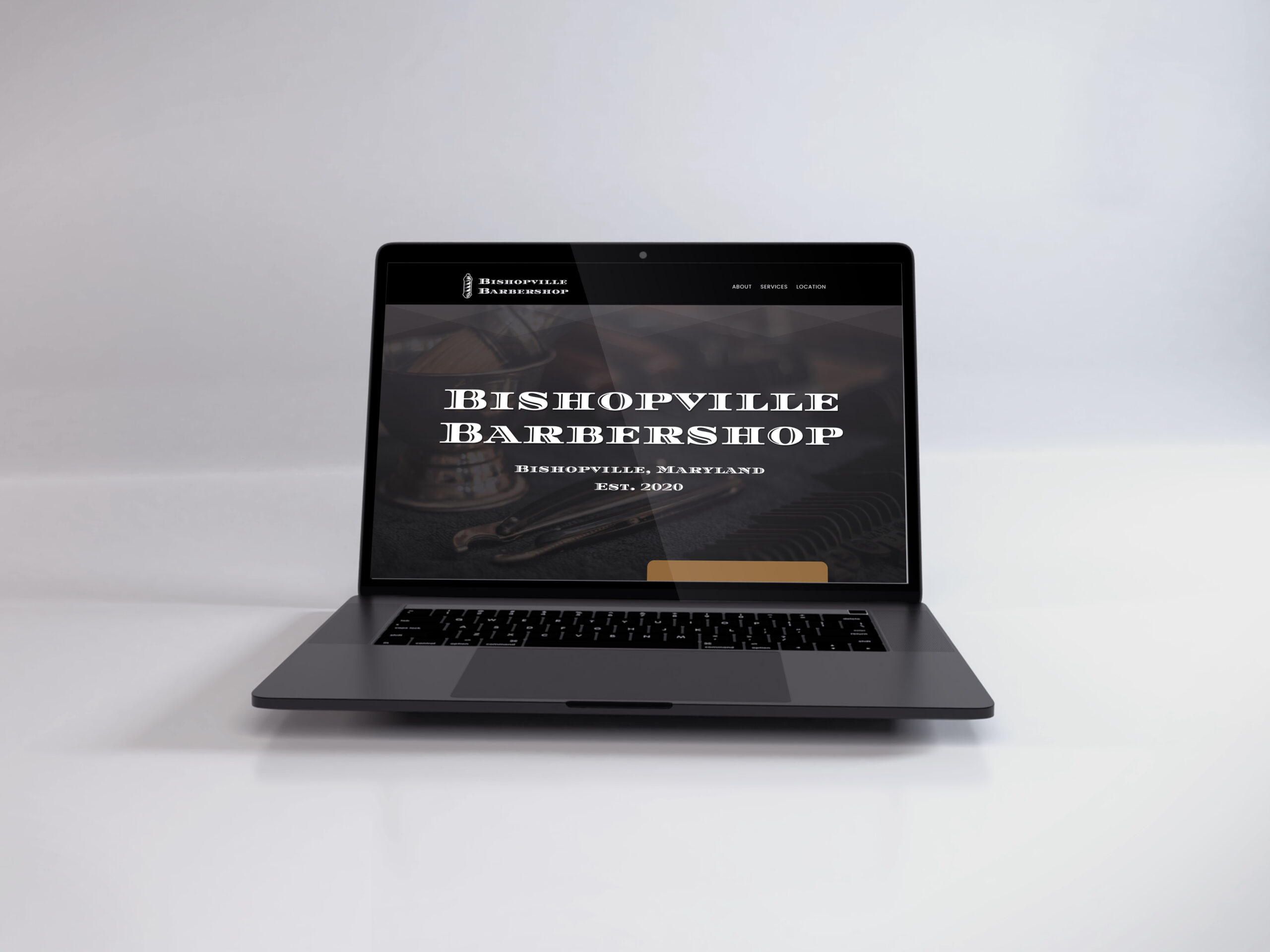 Laptop showing the Bishopville Barbershop website