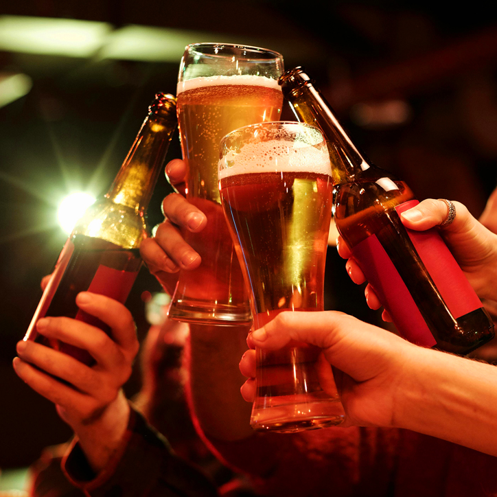 hands in the air cheersing beers hands in the air cheersing beers